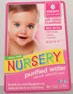 Water for infant formula with fluoride for stronger teeth at the dentist for kids
