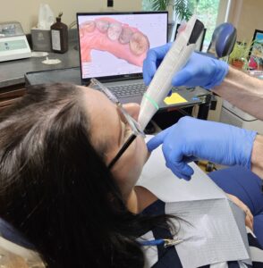 Dr. Nick Calcaterra scanning a patient in our office.